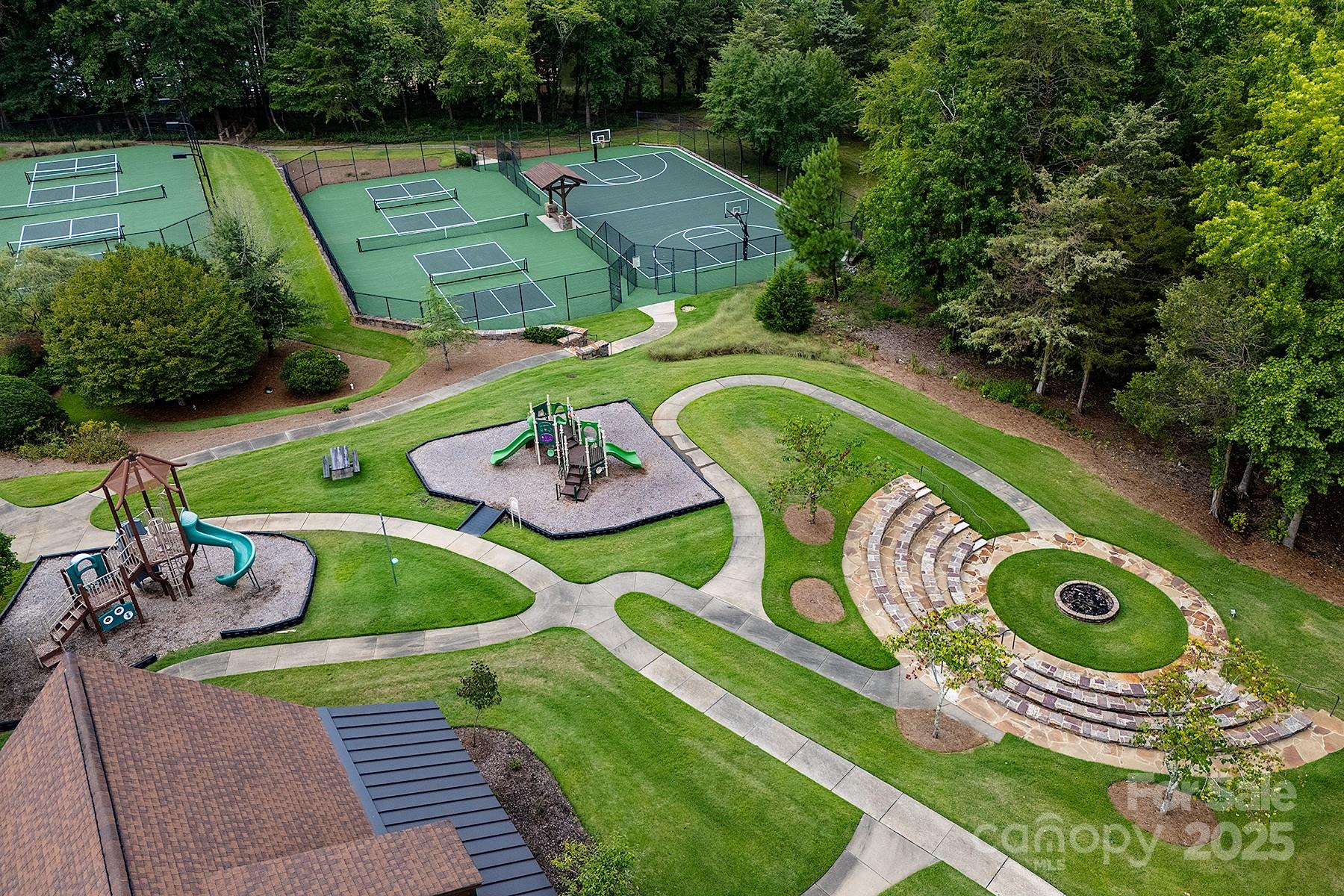 13703 Girl Scout Road, Unit 157 Charlotte, NC 28278 - Photo 19 of 23 a green room with lots of trees