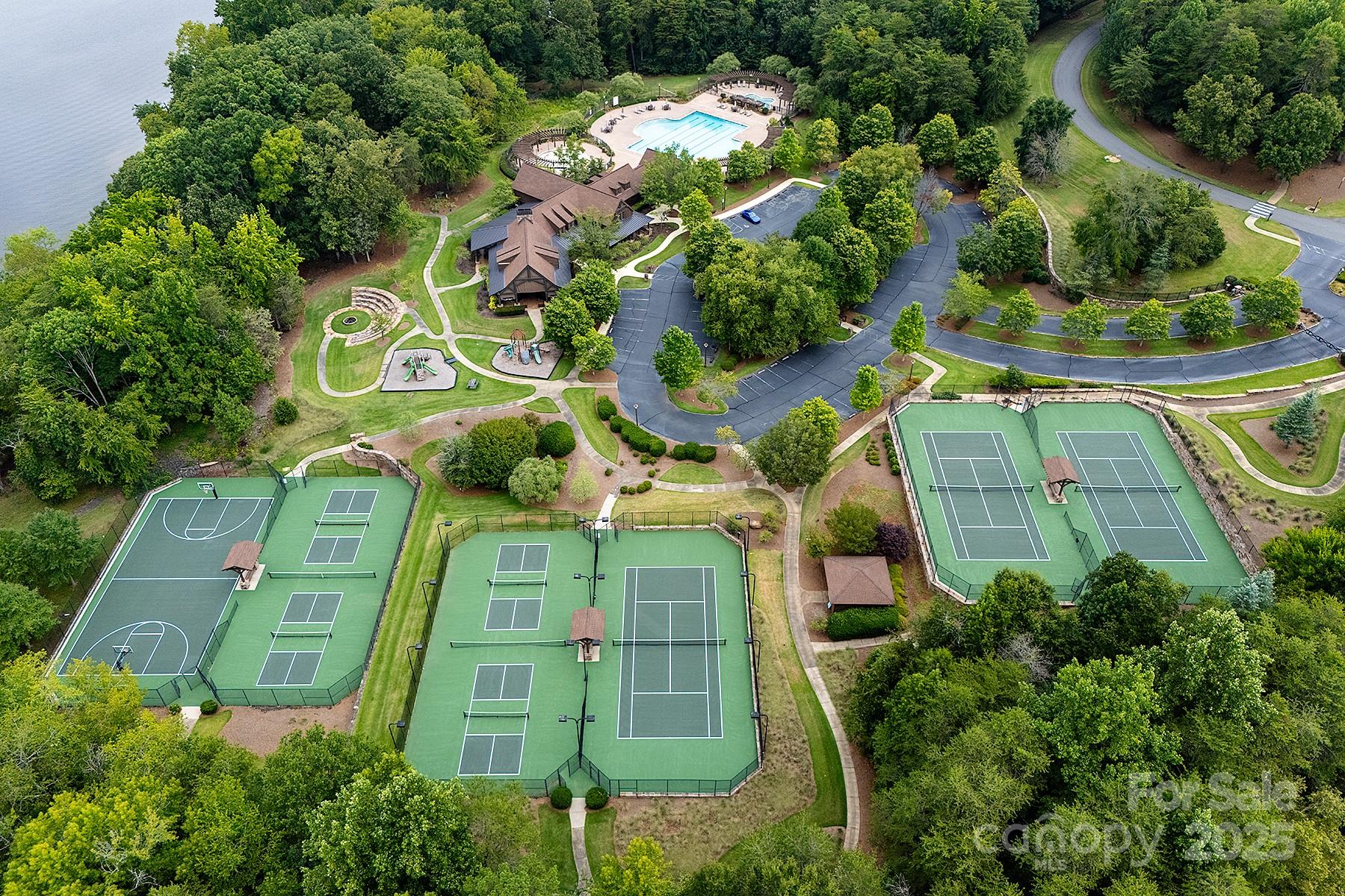 13703 Girl Scout Road, Unit 157 Charlotte, NC 28278 - Photo 22 of 23 an aerial view of a house with a yard and potted plants