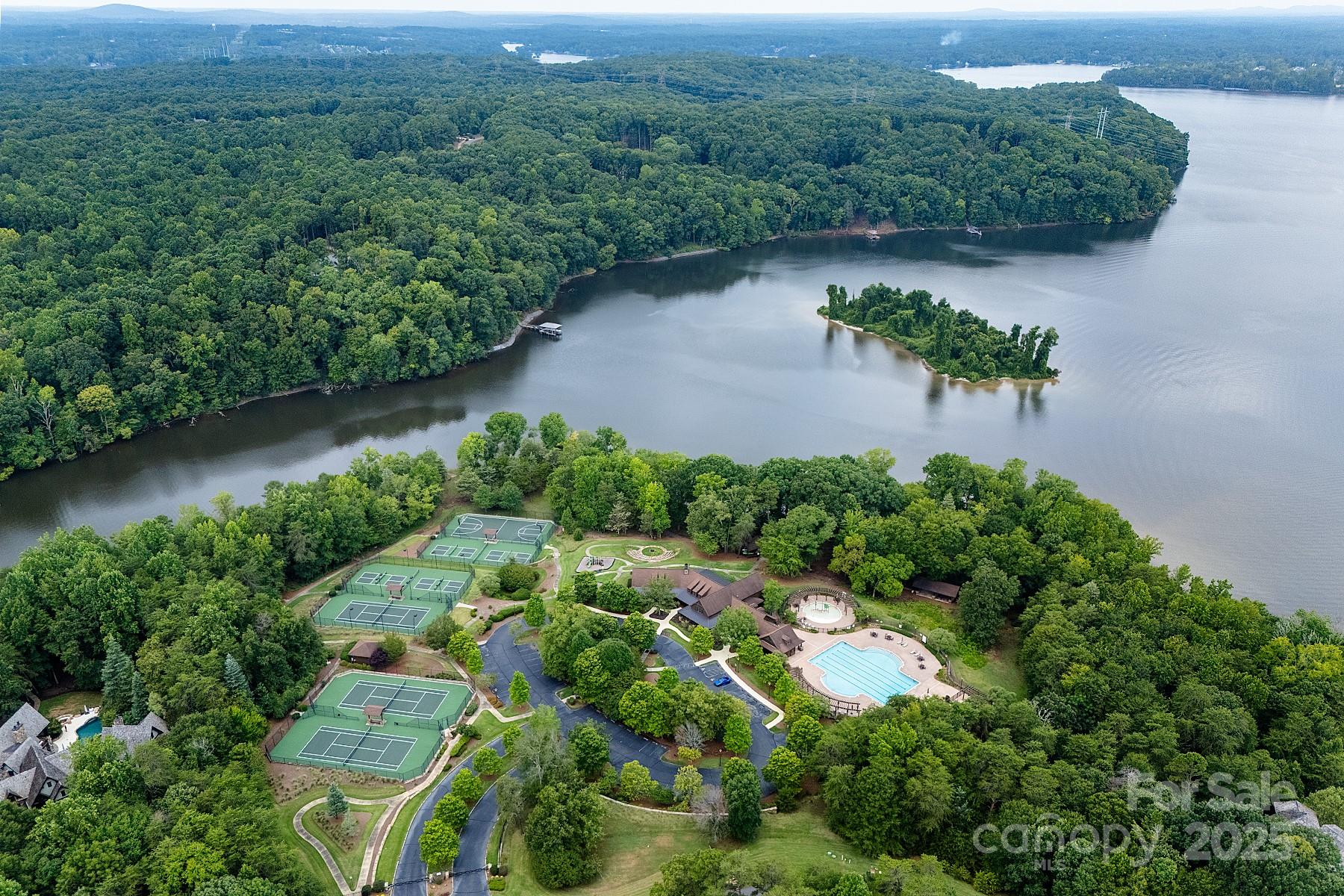 13703 Girl Scout Road, Unit 157 Charlotte, NC 28278 - Photo 23 of 23 an aerial view of a house with outdoor space and lake view