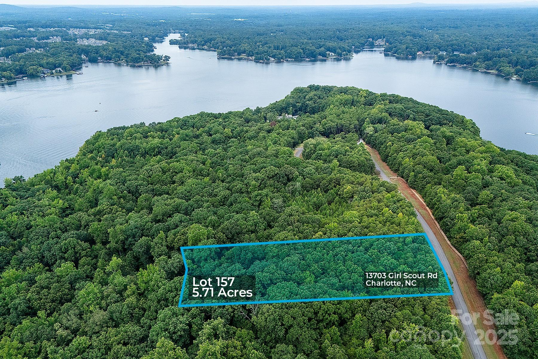 13703 Girl Scout Road, Unit 157 Charlotte, NC 28278 - Photo 8 of 23 an aerial view of a houses with lake view