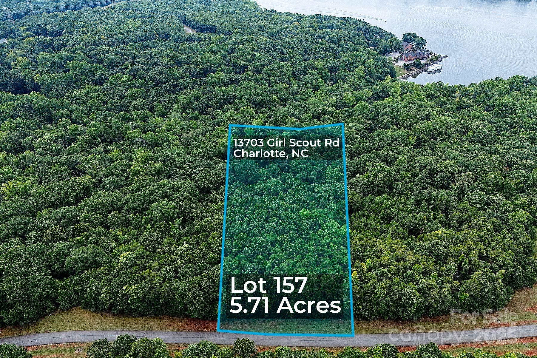 13703 Girl Scout Road, Unit 157 Charlotte, NC 28278 - Photo 10 of 23 a sign that is sitting on a brick wall