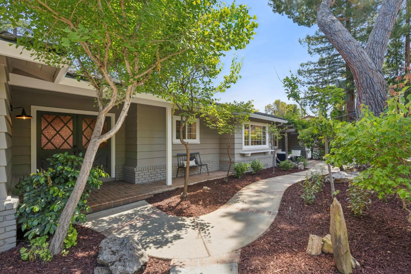 755 Santa Rita Avenue Los Altos, CA 94022 - Photo 1 of 50 a front view of a house with garden