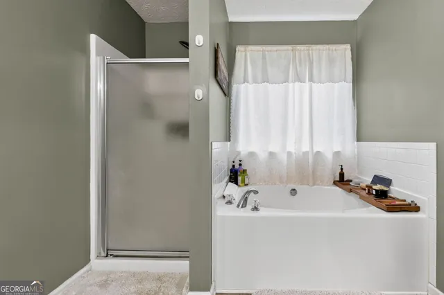 a bathroom with a tub and a window