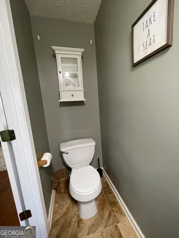 a bathroom with a toilet and a sink