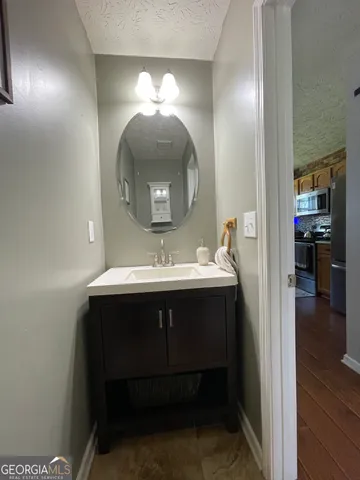 a bathroom with a sink and a mirror
