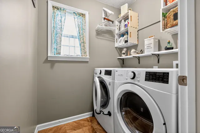 a view of livingroom with washer and dryer