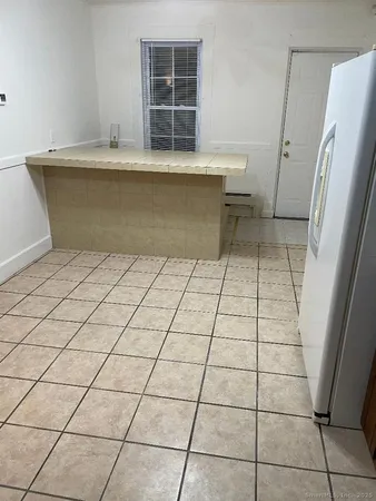 a view of a refrigerator and window