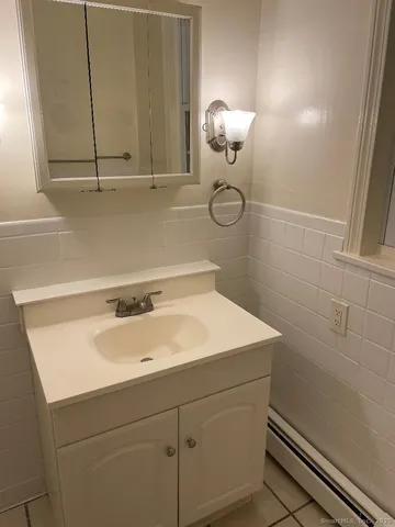a bathroom with a sink and a shower