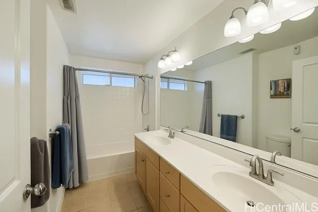 a bathroom with a double vanity sink and a mirror