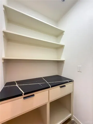 a bedroom with a bed and a shower