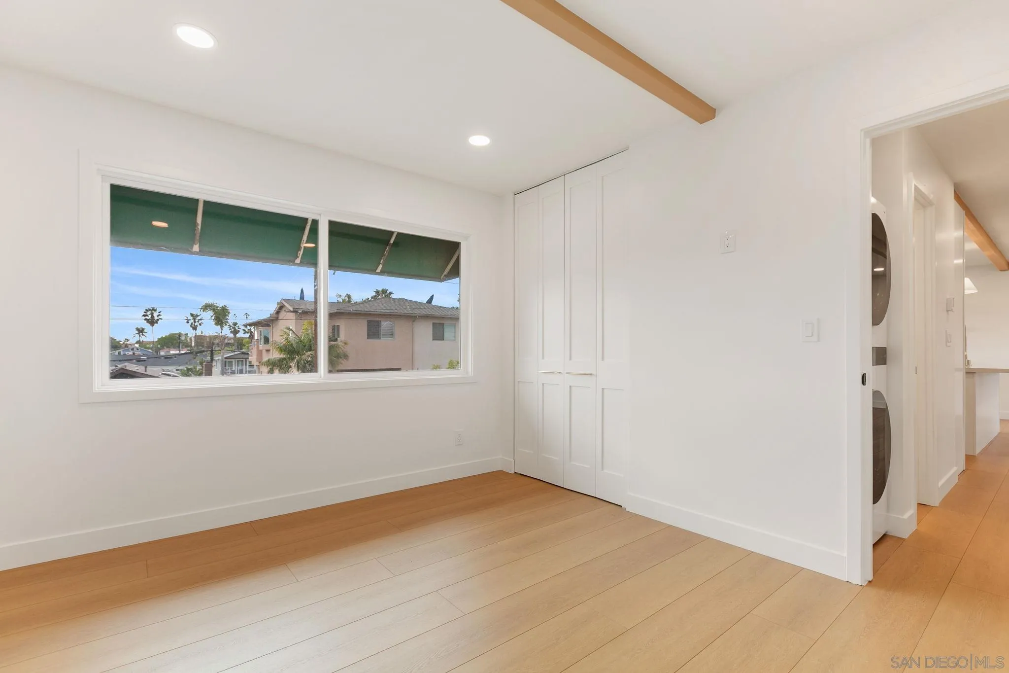 210 A Street, Unit 9 Encinitas, CA 92024 - Photo 18 of 41 a view of an empty room with a window