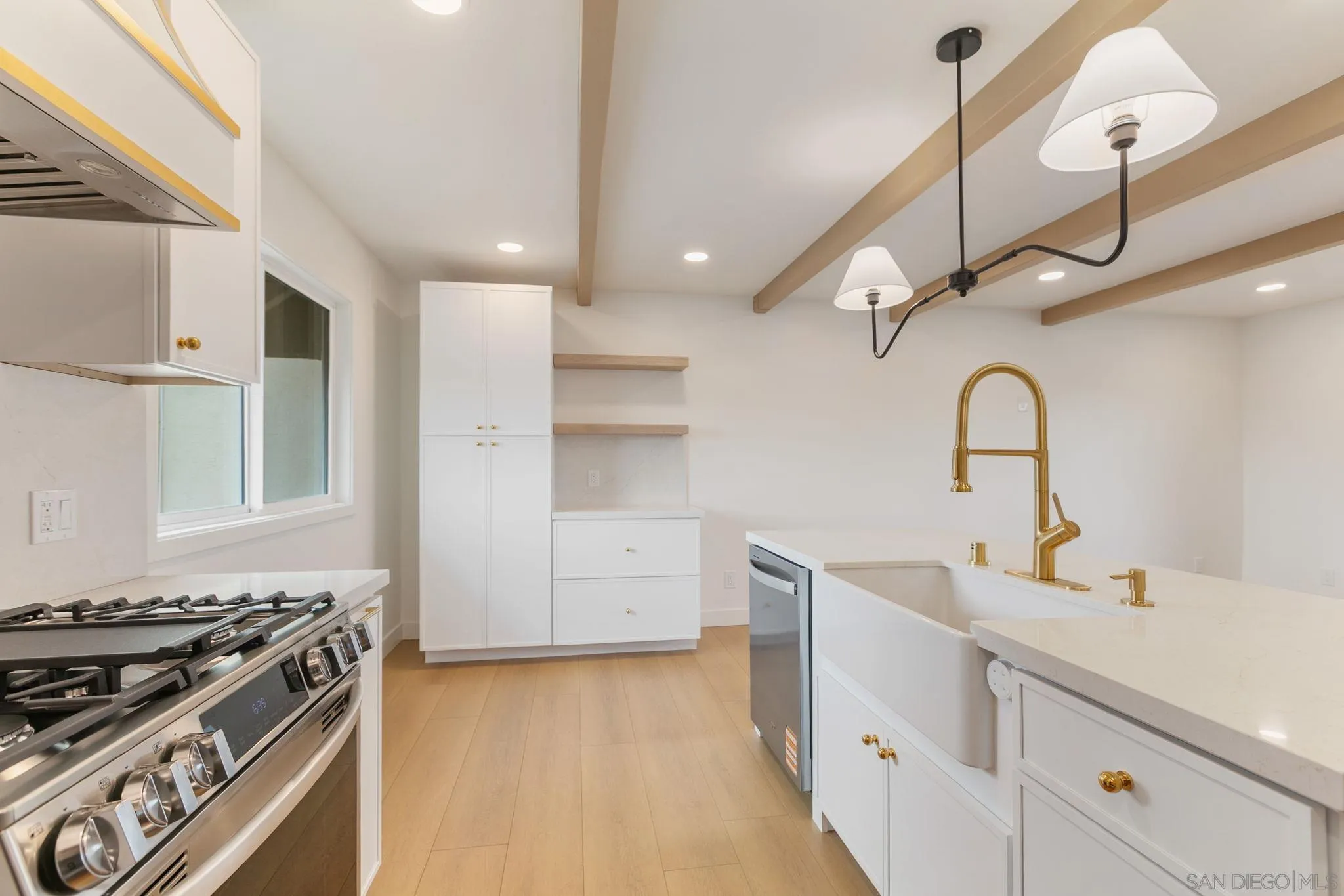 210 A Street, Unit 9 Encinitas, CA 92024 - Photo 8 of 41 a kitchen with a stove and a sink