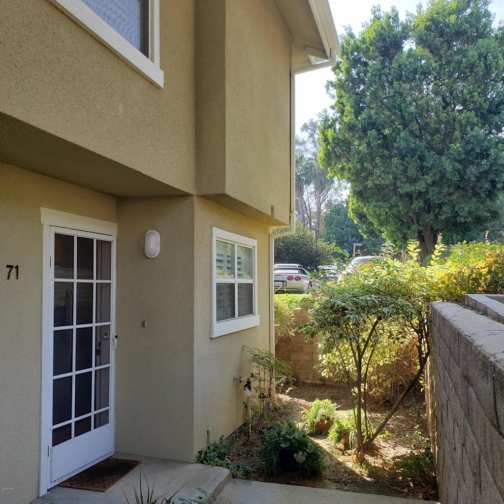 2731 Erringer Road, Unit 71 Simi Valley, CA 93065 - Photo 2 of 45 a view of a house with a yard