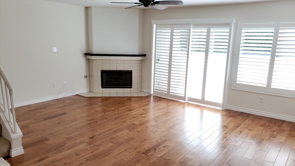 2731 Erringer Road, Unit 71 Simi Valley, CA 93065 - Photo 12 of 45 wooden floor fireplace and windows in an empty room