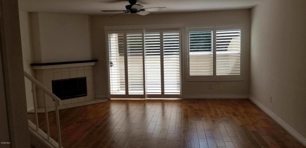 2731 Erringer Road, Unit 71 Simi Valley, CA 93065 - Photo 13 of 45 a view of an empty room with a window and wooden floor