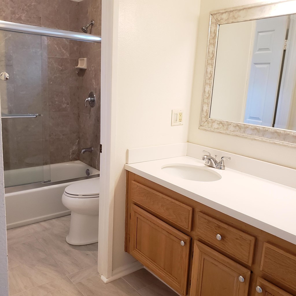 2731 Erringer Road, Unit 71 Simi Valley, CA 93065 - Photo 25 of 45 a bathroom with a sink a toilet and shower