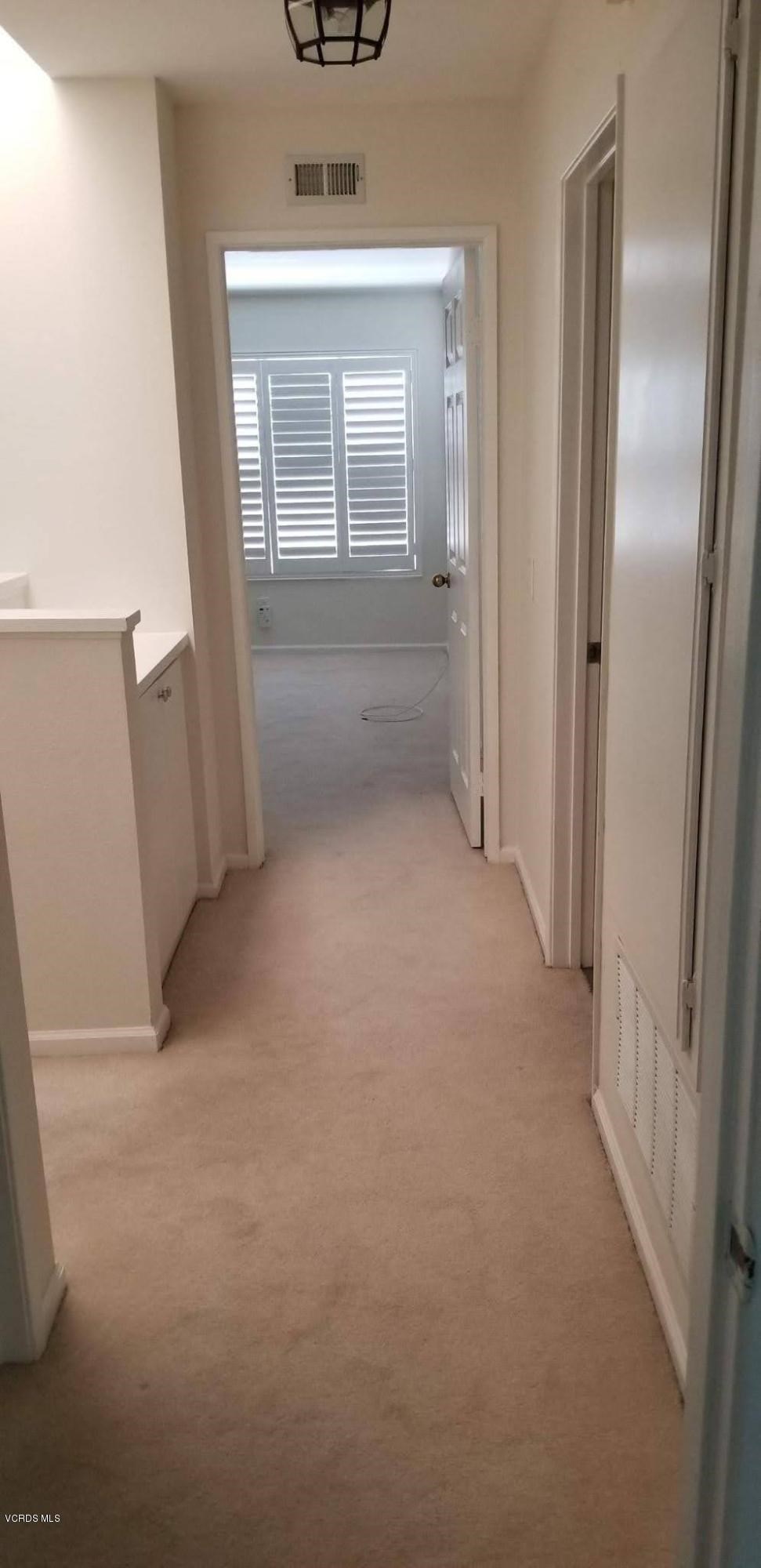 2731 Erringer Road, Unit 71 Simi Valley, CA 93065 - Photo 28 of 45 a view of a hallway to rooms