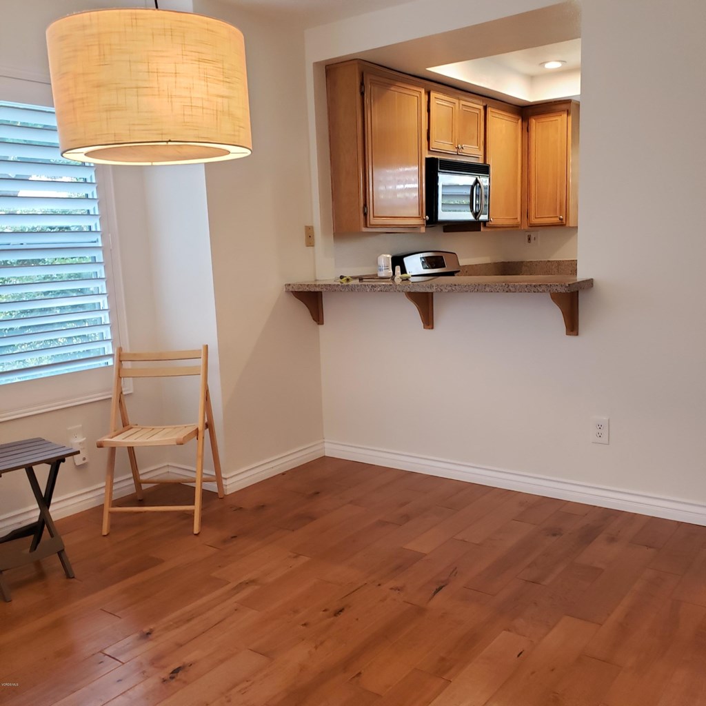 2731 Erringer Road, Unit 71 Simi Valley, CA 93065 - Photo 9 of 45 a room with a table chairs and a window
