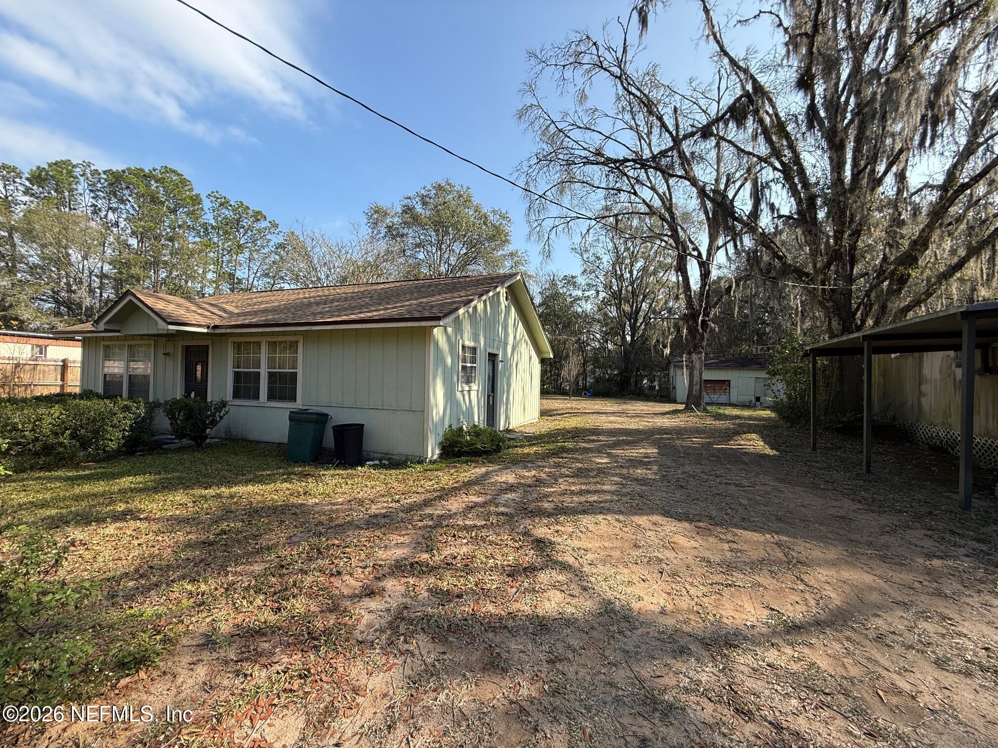 3803 Dottie Road Jacksonville, FL 32220 - Photo 2 of 3 a view of a house with a yard