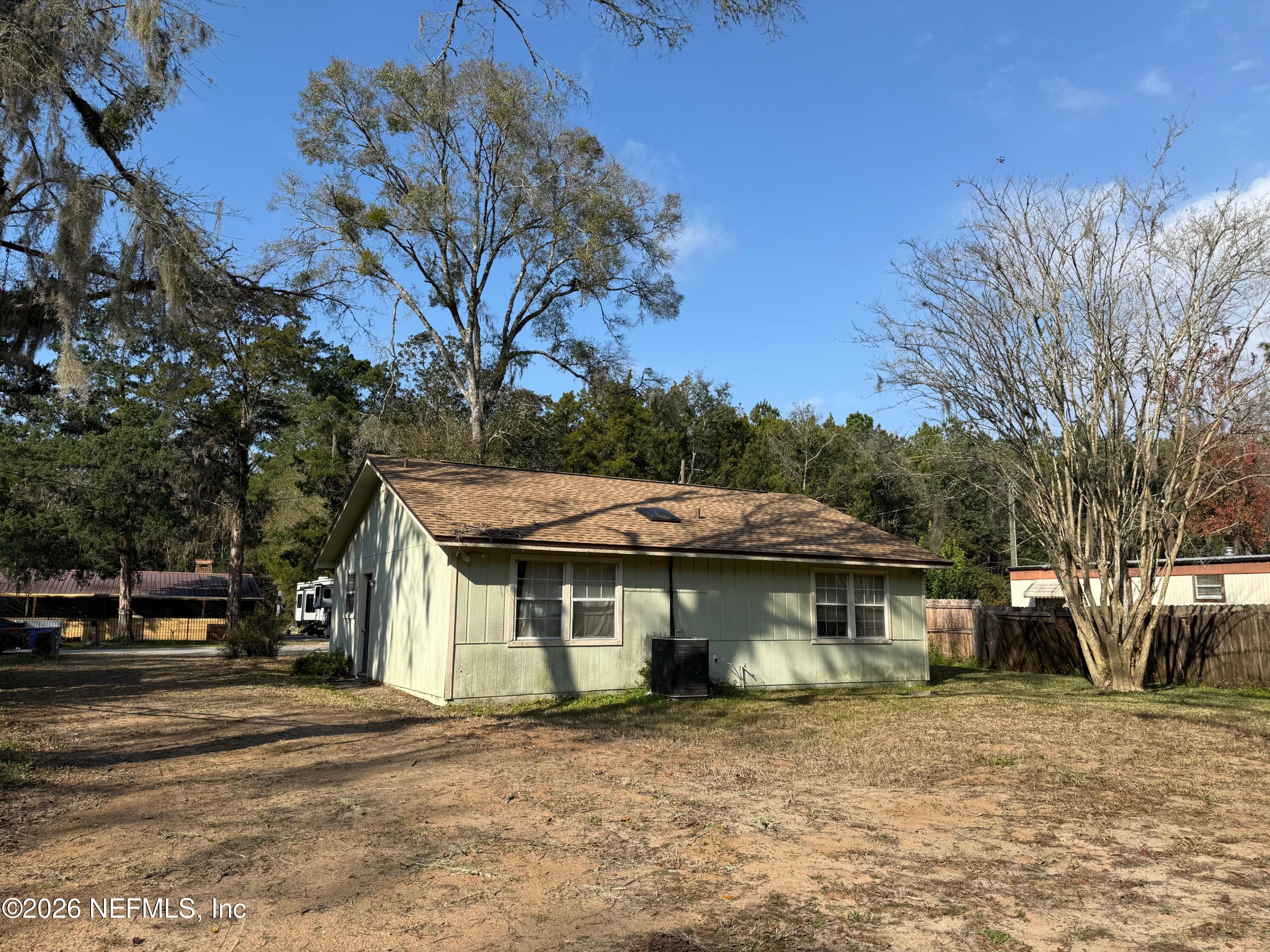 3803 Dottie Road Jacksonville, FL 32220 - Photo 3 of 3 a front view of a house with a garden