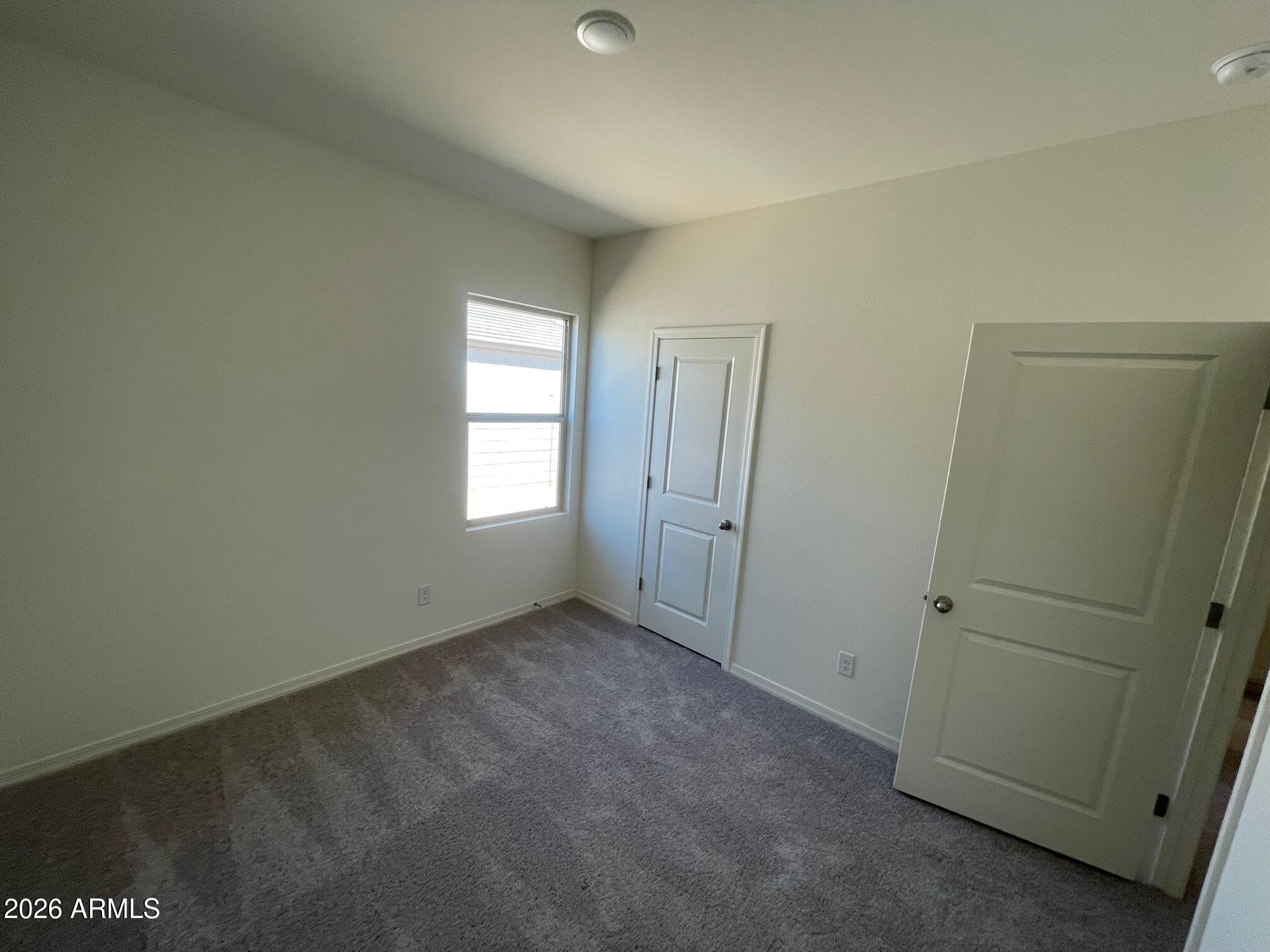 2163 Night Rider Road San Tan Valley, AZ 85140 - Photo 5 of 14 an empty room with windows