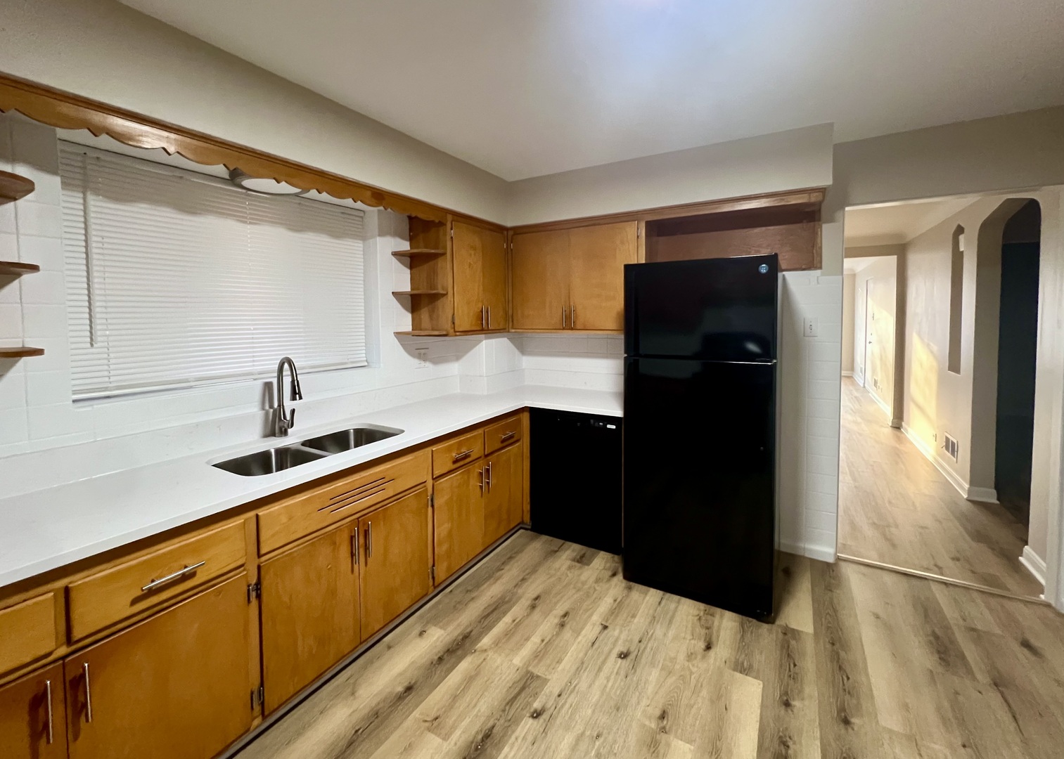 1515 Maple Avenue, Unit 1 Berwyn, IL 60402 - Photo 2 of 12 a kitchen with granite countertop white cabinets and refrigerator
