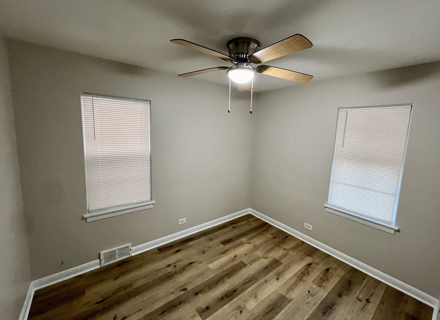 1515 Maple Avenue, Unit 1 Berwyn, IL 60402 - Photo 8 of 12 a view of a room with wooden floor and windows