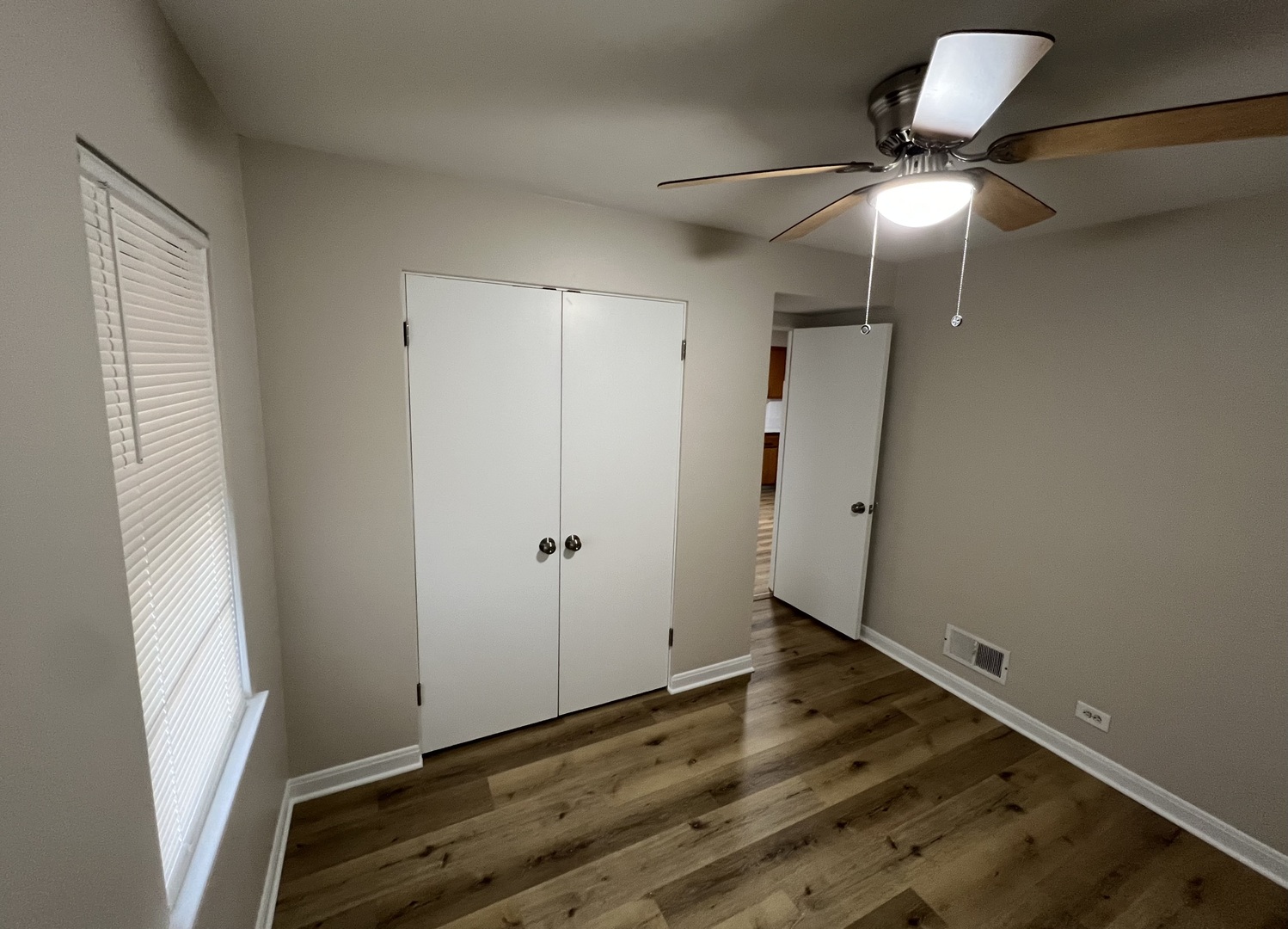 1515 Maple Avenue, Unit 1 Berwyn, IL 60402 - Photo 9 of 12 a view of room with hardwood floor and window