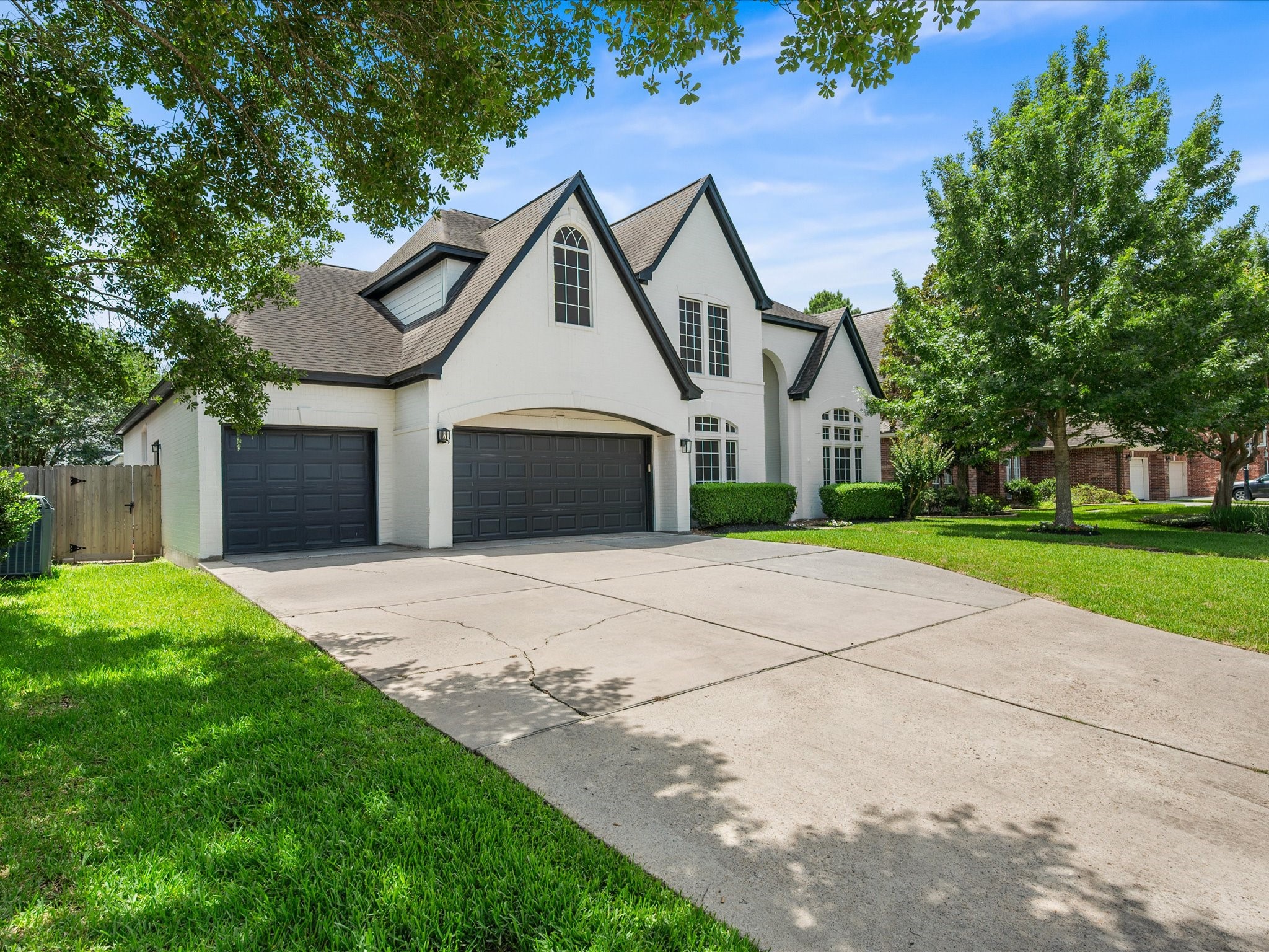 5910 Center Ct Drive Spring, TX 77379 - Photo 6 of 50 The oversized three-car garage offers generous space for vehicles, storage, and hobbies while providing the convenience and flexibility.