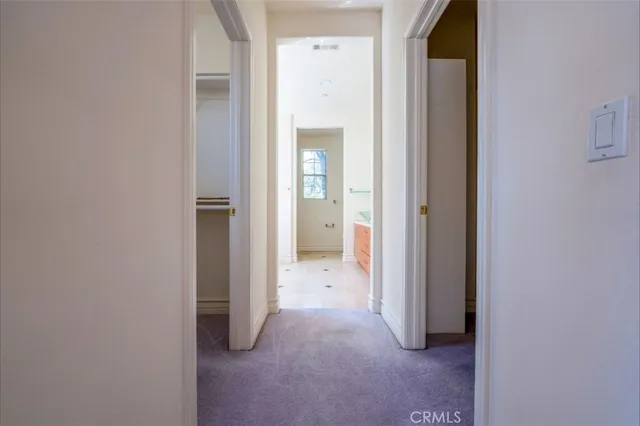 a view of a hallway with closet