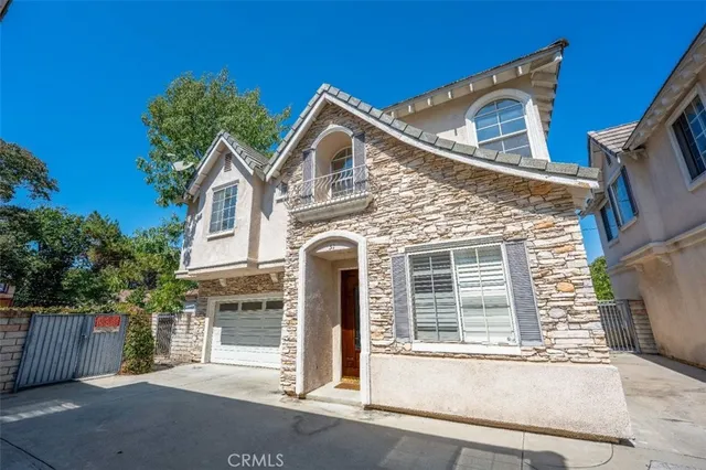 a front view of a house with a garage