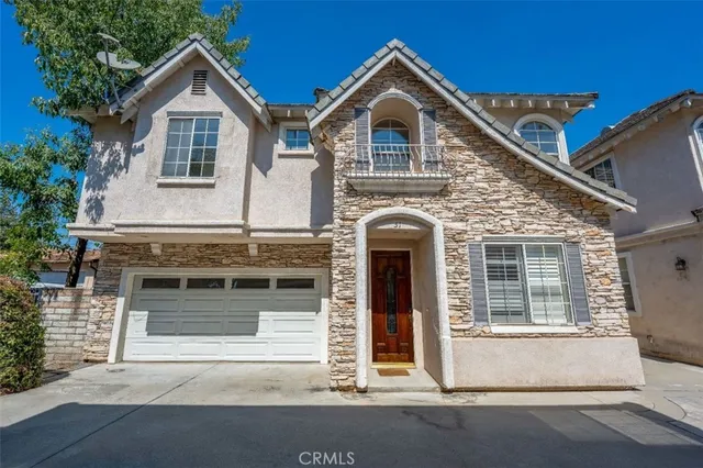a front view of a house with a garage