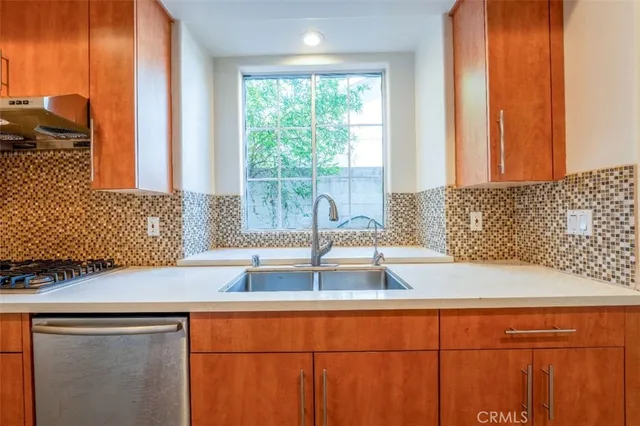 a kitchen with a sink and large window