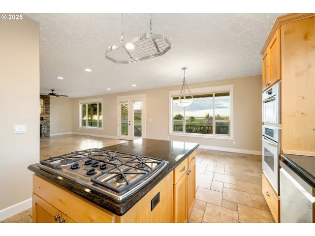 a view of a living room and kitchen
