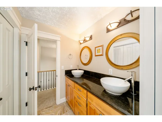 a bathroom with a toilet a sink and a mirror