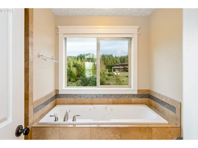 a bathroom with a bathtub and shower