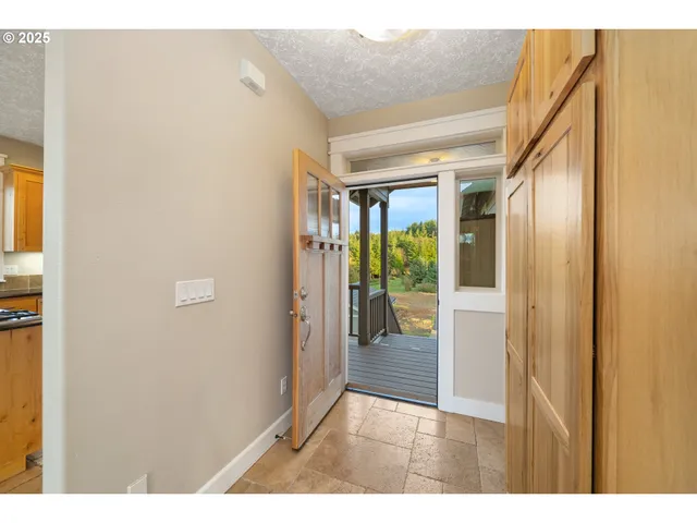 a view of an empty room and fire place