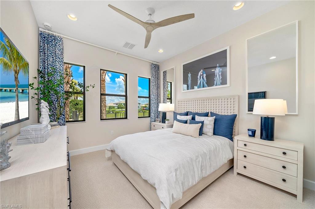 12797 Springbrook Court Estero, FL 33928 - Photo 13 of 30 a bedroom with a large bed and a window