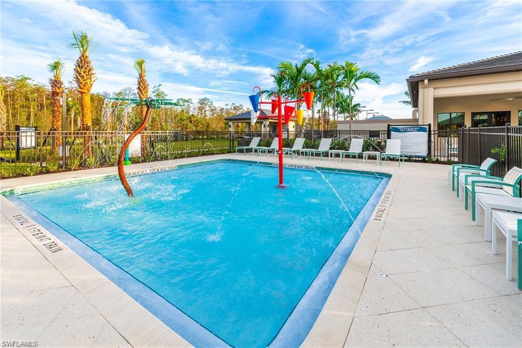 12797 Springbrook Court Estero, FL 33928 - Photo 28 of 30 a swimming pool with outdoor seating and outdoor seating
