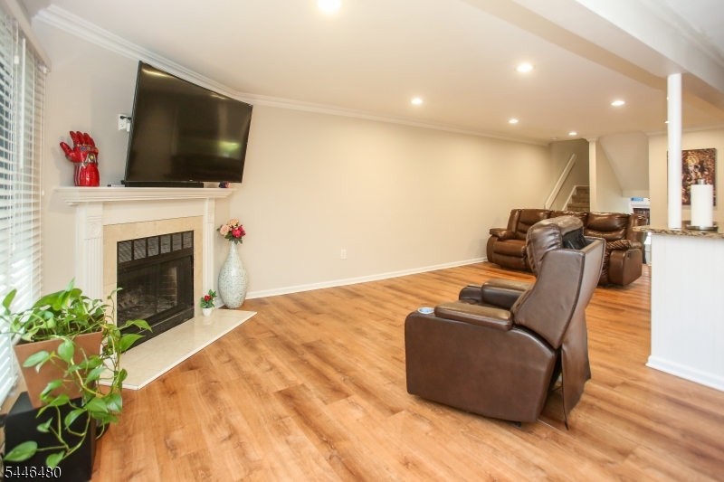 207 Patriots Road Morris Plains, NJ 07950 - Photo 8 of 25 a living room with furniture fireplace and flat screen tv