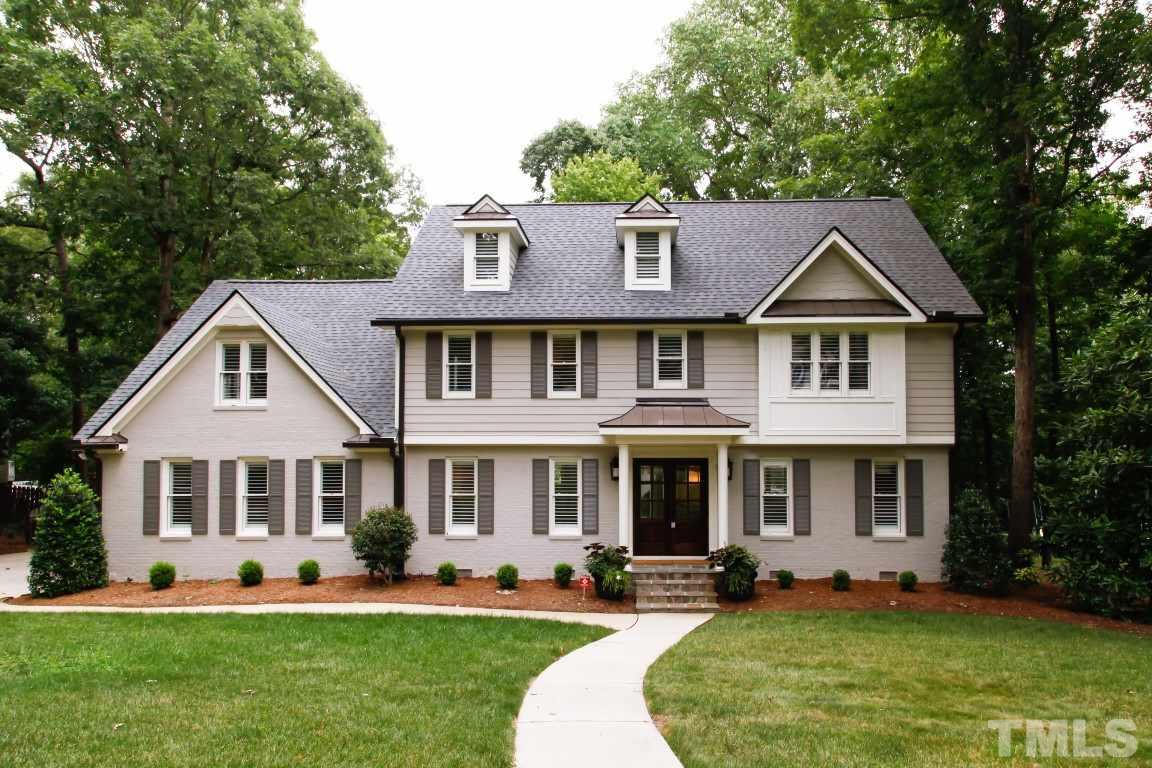 7828 Hardwick Drive Raleigh, NC 27615 - Photo 1 of 25 a front view of a house with a yard and porch