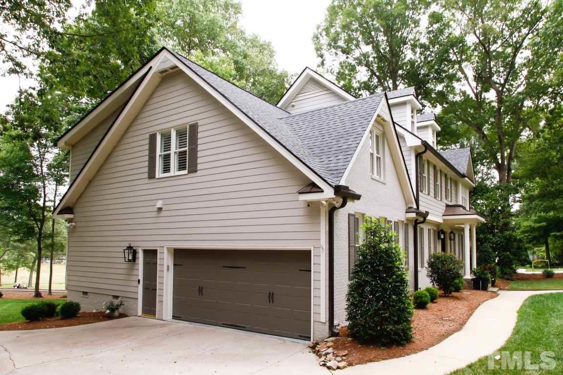 7828 Hardwick Drive Raleigh, NC 27615 - Photo 2 of 25 a view of a house with a yard and potted plants