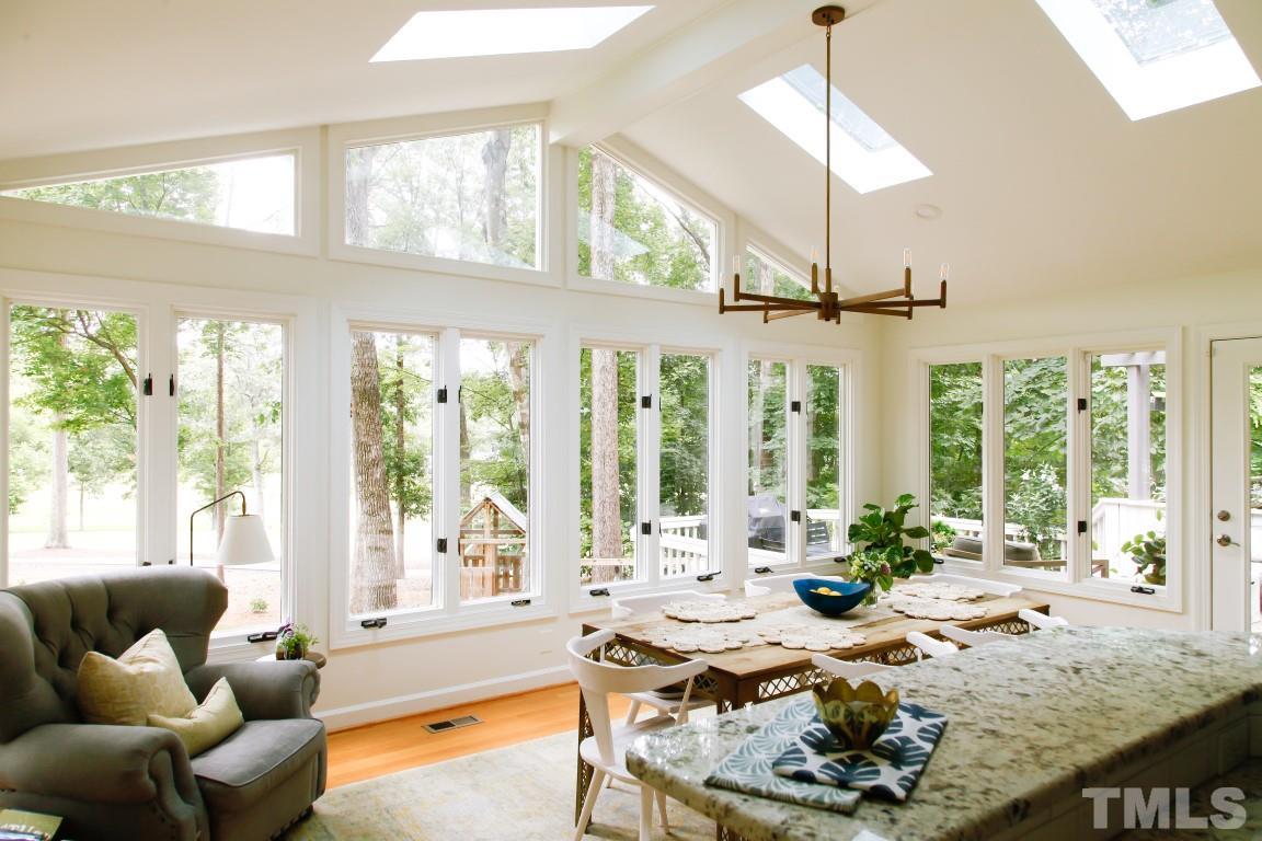 7828 Hardwick Drive Raleigh, NC 27615 - Photo 11 of 25 a living room with furniture and a large window