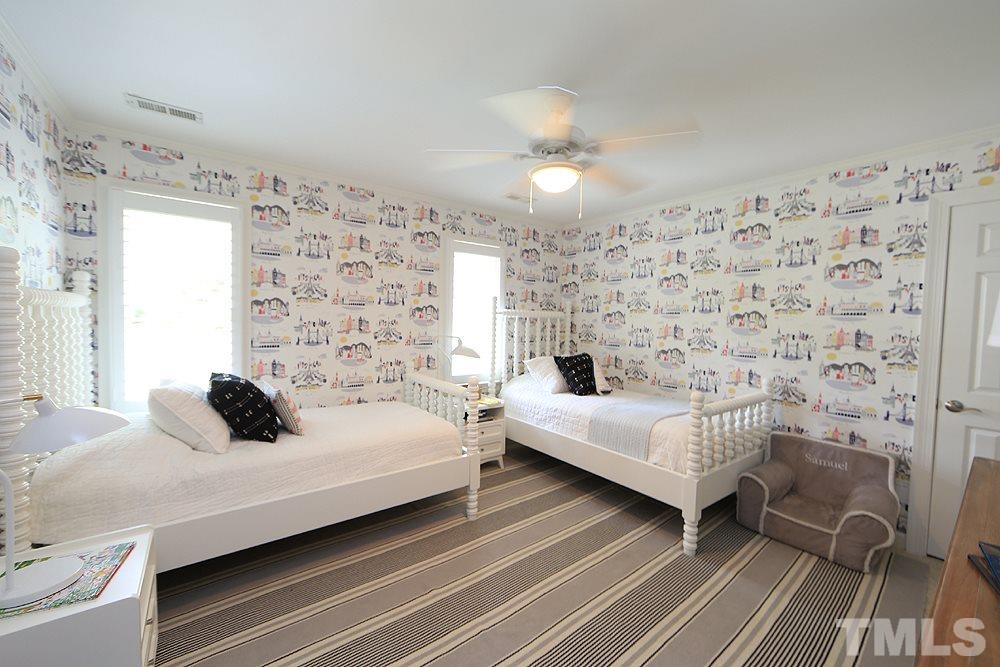 7828 Hardwick Drive Raleigh, NC 27615 - Photo 20 of 25 a bedroom with a bed and a window