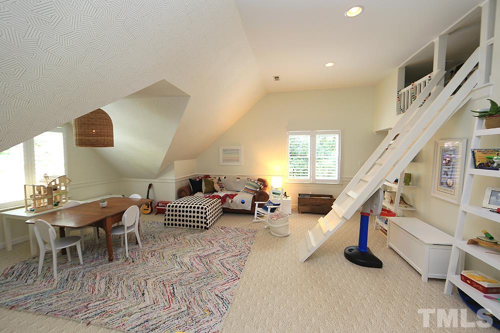 7828 Hardwick Drive Raleigh, NC 27615 - Photo 21 of 25 a living room with furniture and stairs