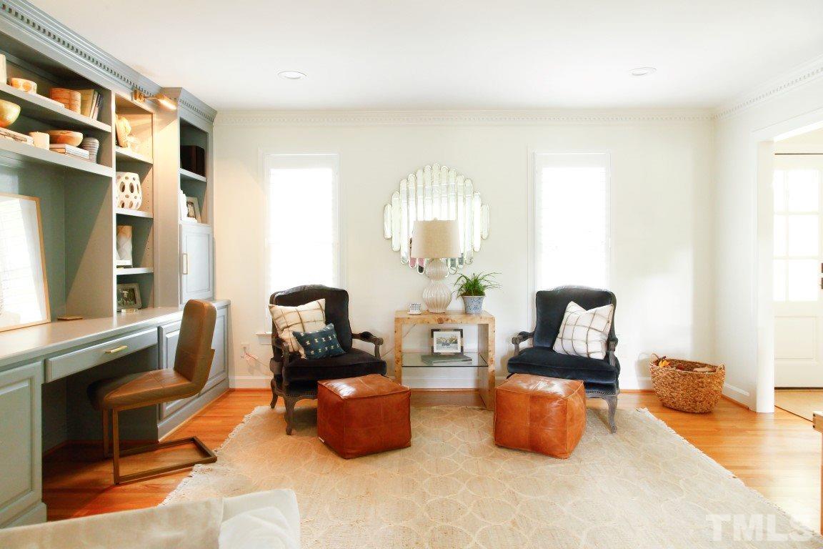 7828 Hardwick Drive Raleigh, NC 27615 - Photo 4 of 25 a living room with furniture and a flat screen tv