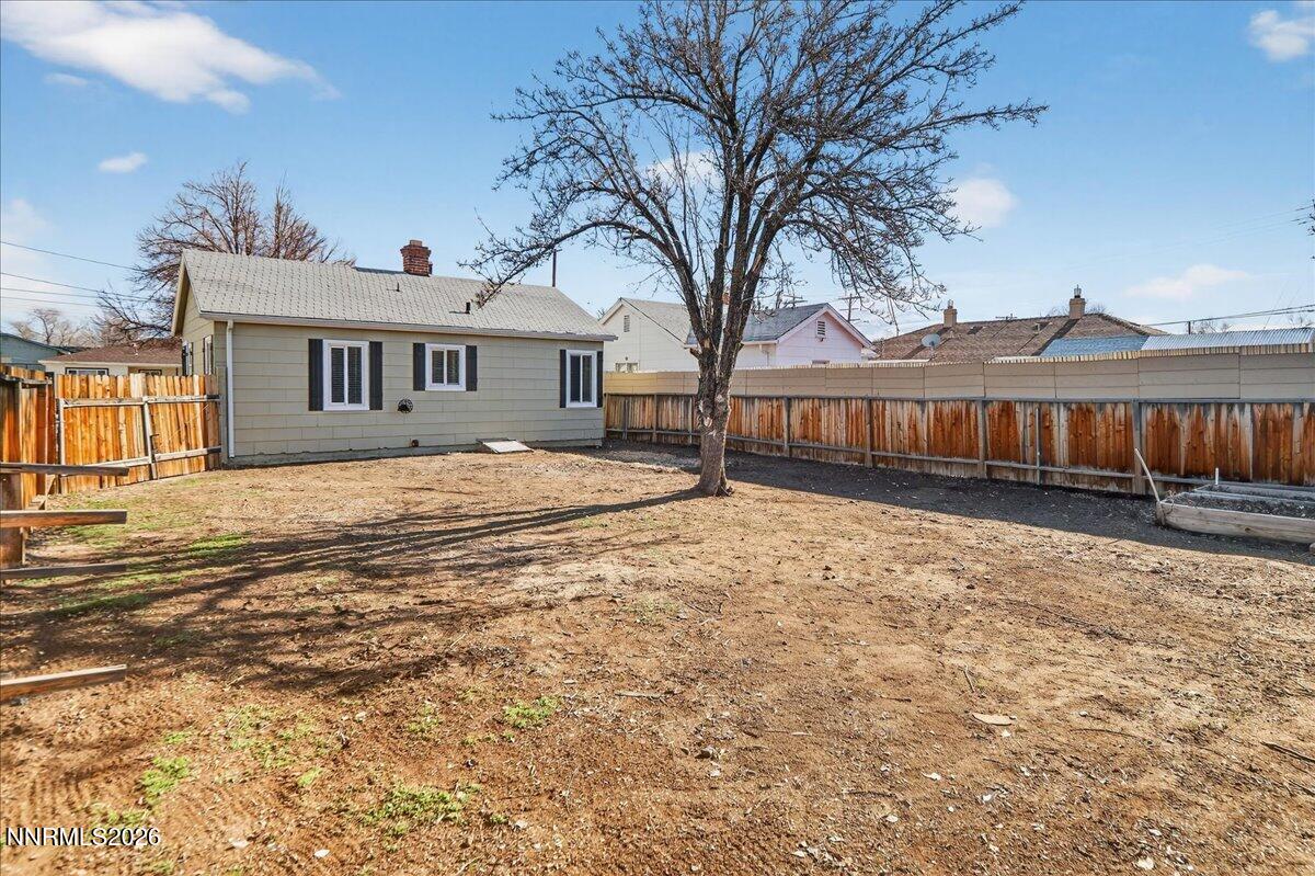 1339 Locust Street Reno, NV 89502 - Photo 20 of 23 a front view of a house with a yard