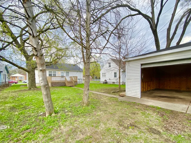 a house that has a tree in front of the house