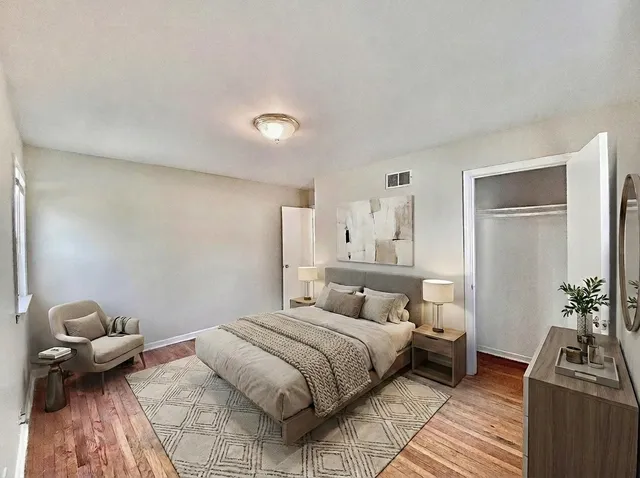 a bedroom with a bed and a couch