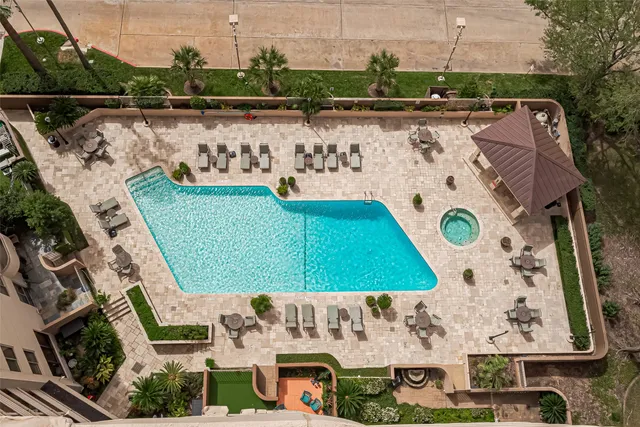 a living room with furniture a fireplace and a chandelier